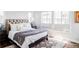 Inviting bedroom with a luxurious bed, natural light, and stylish decor at 16791 W 48Th Ln, Golden, CO 80403