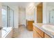 Well-lit bathroom with tile floors, double sinks, and glass enclosed shower at 22813 E Briarwood Pl, Aurora, CO 80016