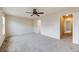 Spacious bedroom with neutral carpet, ceiling fan, and doorways to other rooms at 22813 E Briarwood Pl, Aurora, CO 80016