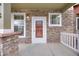 Inviting front porch features stone accents and a white door with glass at 22813 E Briarwood Pl, Aurora, CO 80016