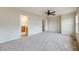Large main bedroom featuring carpet, ceiling fan, and attached bath at 22813 E Briarwood Pl, Aurora, CO 80016
