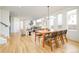 Bright dining room with hardwood floors and a modern light fixture at 4222 Stuart St, Denver, CO 80212