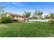 Lush backyard with a raised deck and full basketball court at 1549 Dean Dr, Northglenn, CO 80233