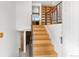Inviting foyer featuring a wood staircase with iron railing and a built-in bookshelf at 1549 Dean Dr, Northglenn, CO 80233