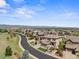Stunning aerial view of the homes in the community with a mountain backdrop at 10757 Timberdash Ave, Highlands Ranch, CO 80126