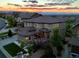 Stunning aerial view of a home at sunset, showcasing its landscaping and architecture at 10757 Timberdash Ave, Highlands Ranch, CO 80126