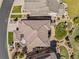 Detailed aerial view showing a manicured backyard and a detailed, tiled roof at 10757 Timberdash Ave, Highlands Ranch, CO 80126