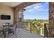 Covered back porch with comfortable seating and views of the playground and surrounding landscape at 10757 Timberdash Ave, Highlands Ranch, CO 80126