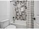 Modern bathroom with stylish tilework and a shower-tub combo at 10757 Timberdash Ave, Highlands Ranch, CO 80126