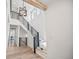 Grand foyer featuring a staircase with metal railing, light hardwood floors, and natural light at 10757 Timberdash Ave, Highlands Ranch, CO 80126