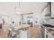 Bright kitchen featuring a granite island, stainless steel appliances, and modern finishes at 10757 Timberdash Ave, Highlands Ranch, CO 80126