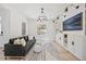 Bright living room with hardwood floors, custom built-ins, and a large window at 10757 Timberdash Ave, Highlands Ranch, CO 80126