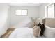 Calm bedroom with a comfortable bed, neutral tones, and soft natural light at 1330 Olive St, Denver, CO 80220