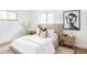 Comfortable bedroom with plush bedding, modern decor, and stylish bedside tables at 1330 Olive St, Denver, CO 80220
