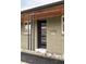 Modern front door with glass panes, enhancing the curb appeal of this home at 1330 Olive St, Denver, CO 80220