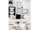 Close up of living room showcasing stylish decor, modern artwork, and comfortable white seating at 1330 Olive St, Denver, CO 80220