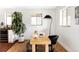 Bright office space featuring a minimalist desk, modern lighting, and neutral color palette at 1330 Olive St, Denver, CO 80220