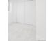 Bright room showcasing pristine white walls, light carpet, and minimalist decor at 1330 Olive St, Denver, CO 80220