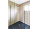 Modern shower showcasing sleek glass enclosure, rain shower head, and stylish tile work at 1330 Olive St, Denver, CO 80220