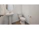 Neat half bath with a pedestal sink and modern fixtures at 24790 E 39Th Ave, Aurora, CO 80019