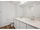 Bright bathroom featuring a double sink vanity with white cabinets and granite countertop and shower at 24790 E 39Th Ave, Aurora, CO 80019