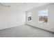 Bedroom featuring neutral carpet, two windows, and neutral paint at 24790 E 39Th Ave, Aurora, CO 80019
