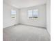 Spacious bedroom featuring gray carpet, neutral walls and window overlooking a neighborhood at 24790 E 39Th Ave, Aurora, CO 80019