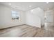 Bright, open-concept living area with sleek hardwood floors and ample natural light at 24790 E 39Th Ave, Aurora, CO 80019