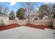 Enjoy this concrete patio in the backyard space with landscaped mulch area and partial fencing at 1011 S Valentia St # 3, Denver, CO 80247
