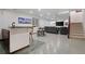 Spacious basement with a bar area, comfortable seating, and easy access to the upper level at 1011 S Valentia St # 3, Denver, CO 80247