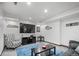 Finished basement featuring a comfortable seating area with a large screen TV and bar decor at 1011 S Valentia St # 3, Denver, CO 80247