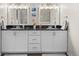Bathroom featuring a double vanity with granite countertop, contemporary fixtures and decorative art at 1011 S Valentia St # 3, Denver, CO 80247