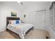 Charming bedroom features plush carpet, a bed with unique linens, and ample closet space at 1011 S Valentia St # 3, Denver, CO 80247