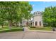 Charming home with a tower-like architectural detail, surrounded by lush greenery, enhancing its curb appeal at 1011 S Valentia St # 3, Denver, CO 80247