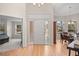 Bright foyer with hardwood floors, arched windows, and a view into the dining area at 1011 S Valentia St # 3, Denver, CO 80247