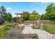 A community hot tub sits under a pergola and is surrounded by beautiful landscaping at 1011 S Valentia St # 3, Denver, CO 80247