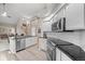 Modern kitchen featuring white cabinets, stainless steel appliances, and an open layout at 1011 S Valentia St # 3, Denver, CO 80247
