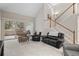 Comfortable living room with staircase access and sliding doors to the patio at 1011 S Valentia St # 3, Denver, CO 80247
