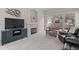 Cozy living room with a fireplace, plush seating, and sliding door access at 1011 S Valentia St # 3, Denver, CO 80247
