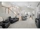Bright living room with open floor plan to the kitchen and staircase access at 1011 S Valentia St # 3, Denver, CO 80247