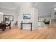 Open-concept living space with hardwood floors connecting the dining area and living room at 1011 S Valentia St # 3, Denver, CO 80247