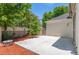 Concrete patio area with tasteful yard featuring a privacy fence at 1011 S Valentia St # 3, Denver, CO 80247