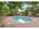 A community pool sits in front of a community clubhouse and lounge chairs surround the pool at 1011 S Valentia St # 3, Denver, CO 80247