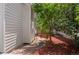 Landscaped side yard with stone path and mature landscaping at 1011 S Valentia St # 3, Denver, CO 80247