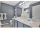 Well-lit bathroom showcases a vanity with a large mirror and modern fixtures at 9080 Gale Blvd # 4, Thornton, CO 80260