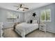 Charming bedroom boasts natural light from two windows and a modern ceiling fan at 9080 Gale Blvd # 4, Thornton, CO 80260