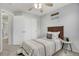 Comfortable bedroom featuring a ceiling fan, decor, and closet at 9080 Gale Blvd # 4, Thornton, CO 80260