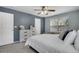Bright bedroom features a ceiling fan and a nice dresser with decorations at 9080 Gale Blvd # 4, Thornton, CO 80260