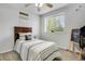 Stylish bedroom featuring a decorative chalkboard and an updated ceiling fan at 9080 Gale Blvd # 4, Thornton, CO 80260