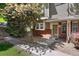 Beautiful townhome with brick accents, well-manicured landscaping, and a welcoming front porch at 9080 Gale Blvd # 4, Thornton, CO 80260